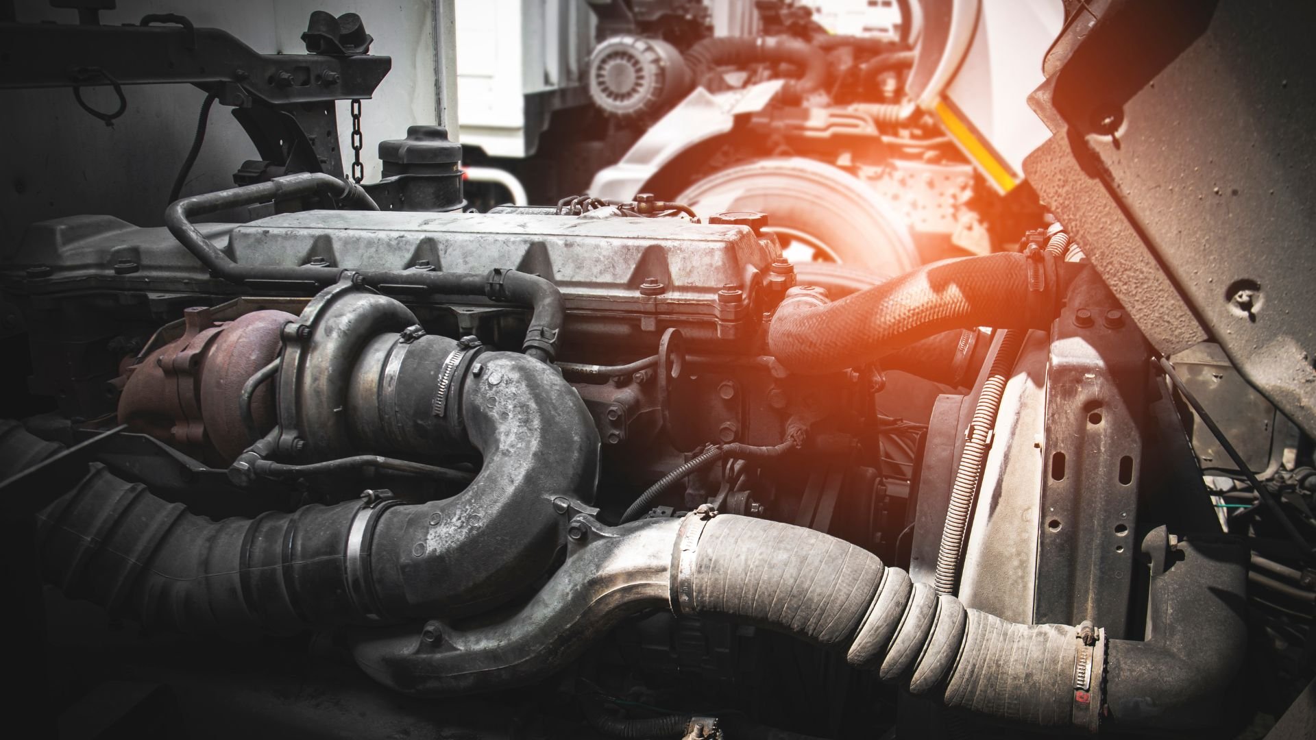 Close-up of a complex car engine with metal pipes and mechanical components